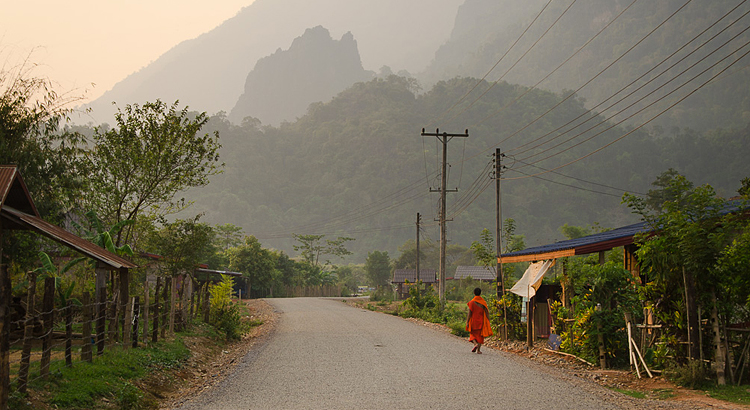 Monk walking alone in Laos